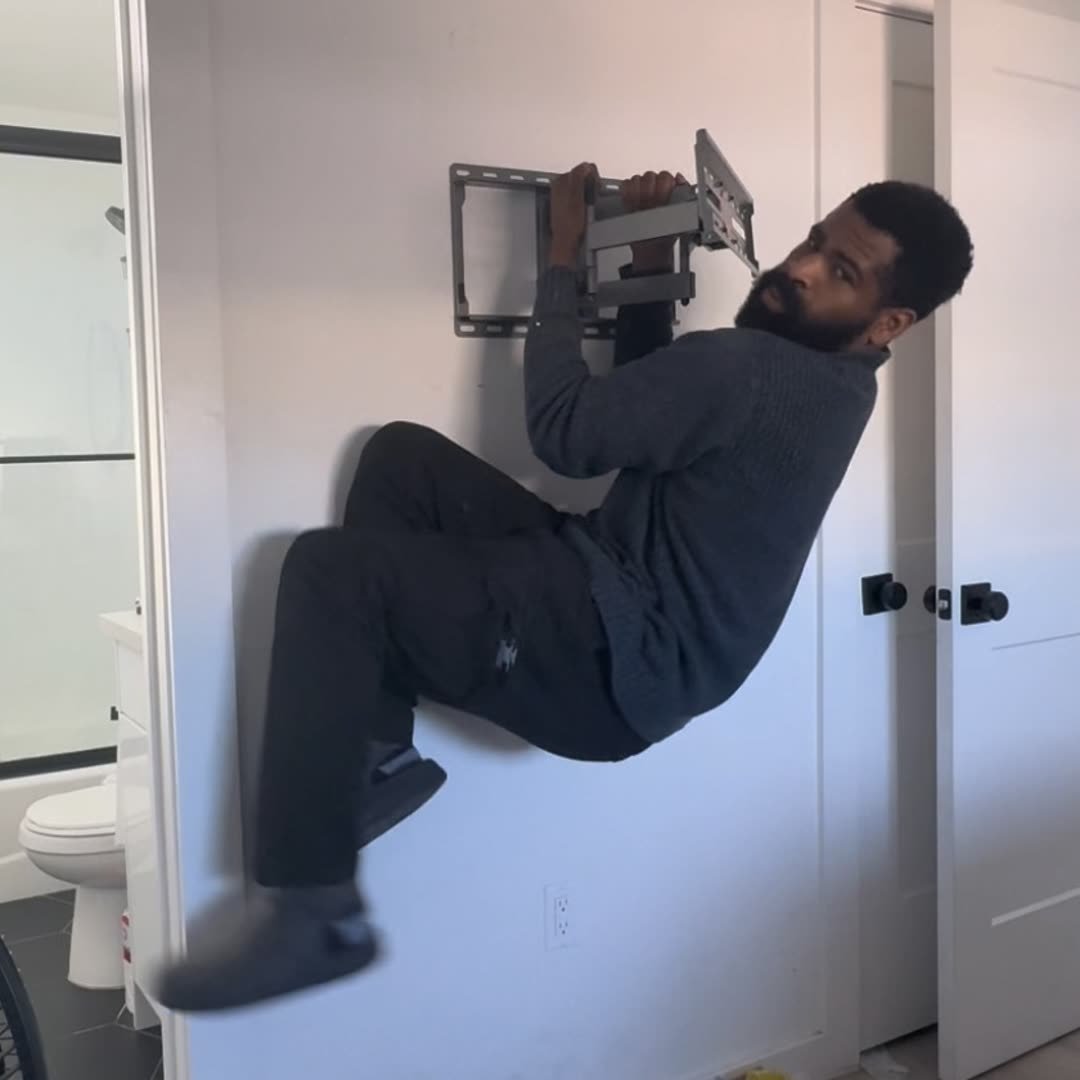 Ike mounting a TV bracket