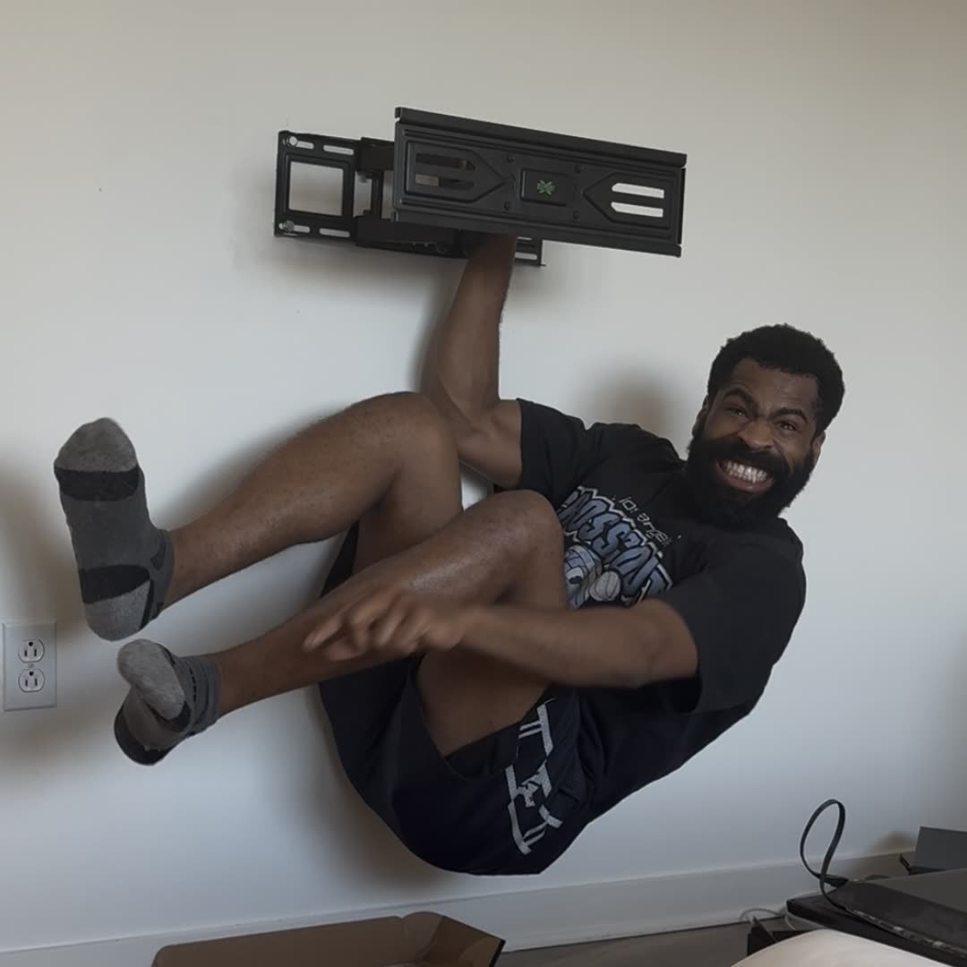 Ike holding a full-motion mount