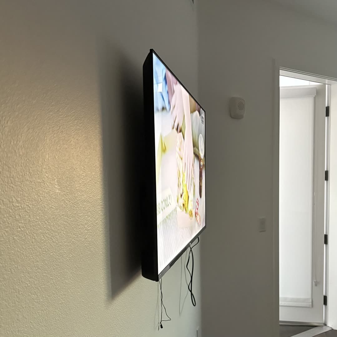 TV mounted on wall side profile