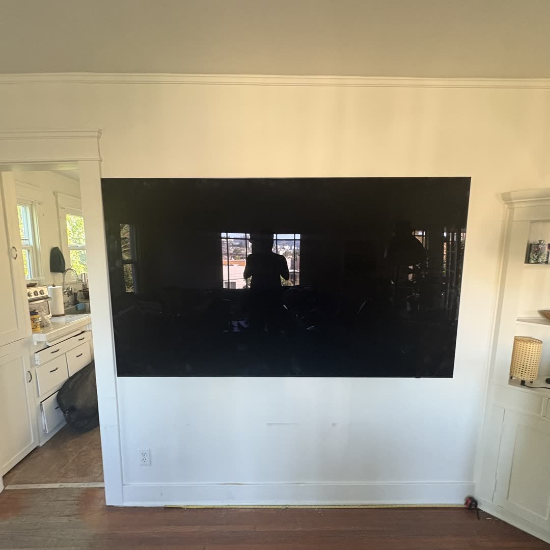 Massive 85 inch TV mounted in living room