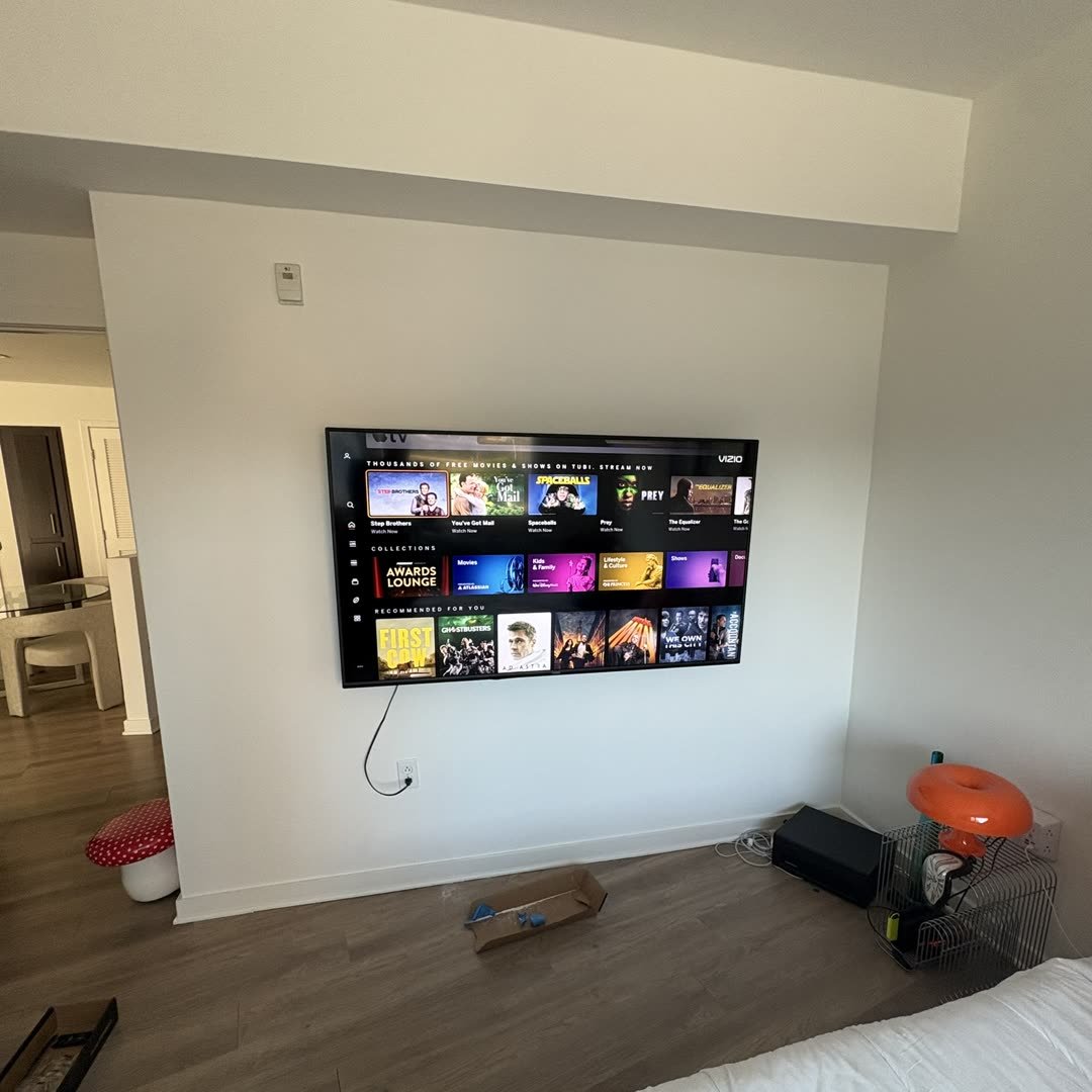 VIZIO TV mounted in bedroom