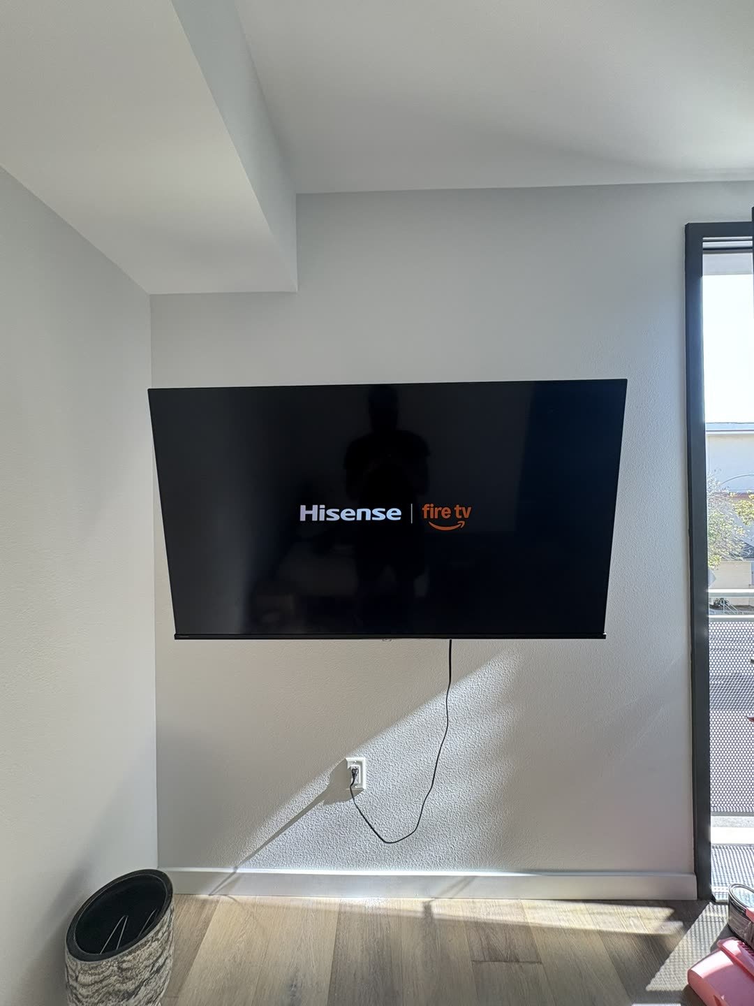 Hisense Fire TV mounted on white wall