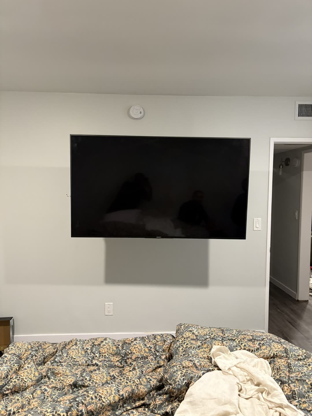 Sony TV mounted in bedroom