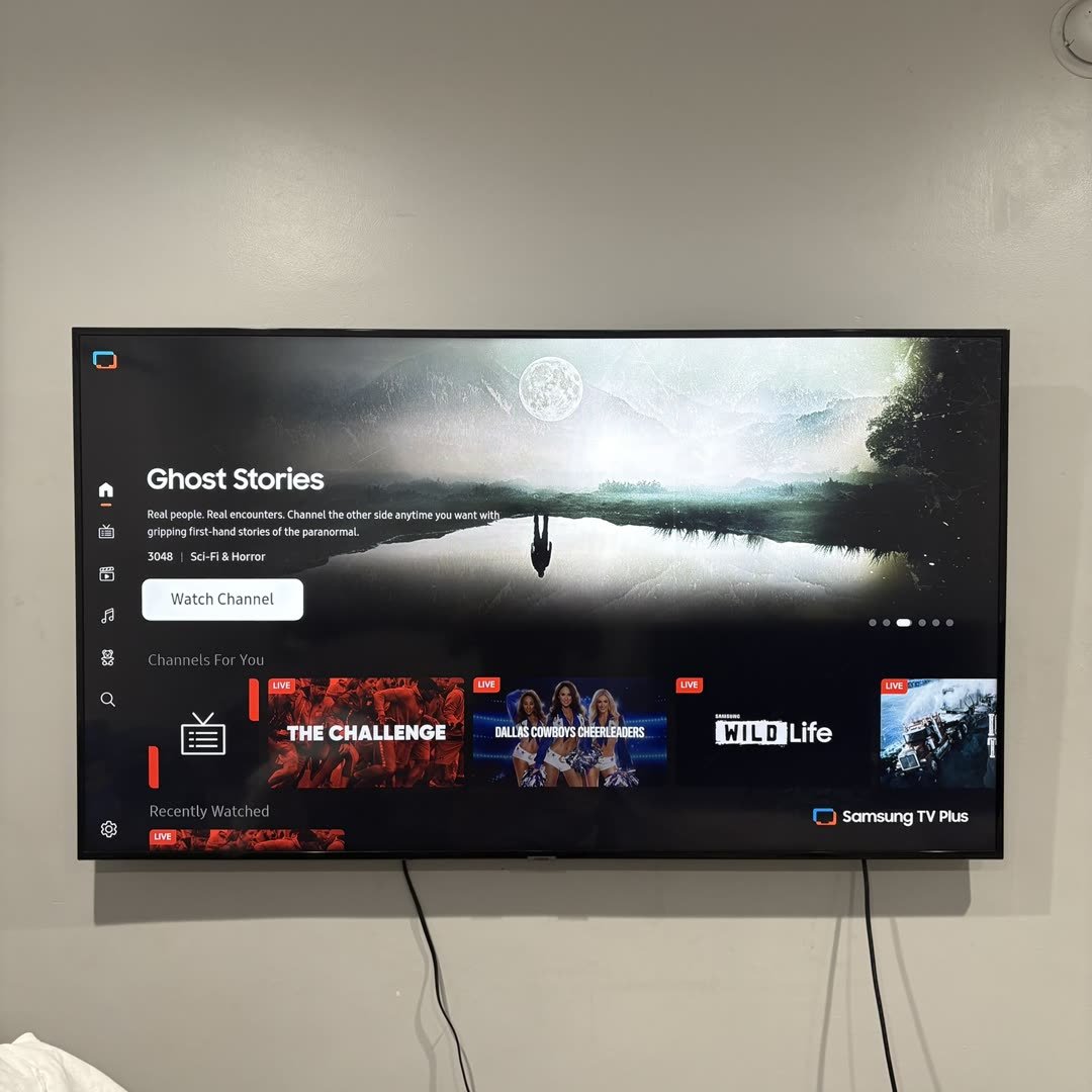 Samsung TV mounted in bedroom