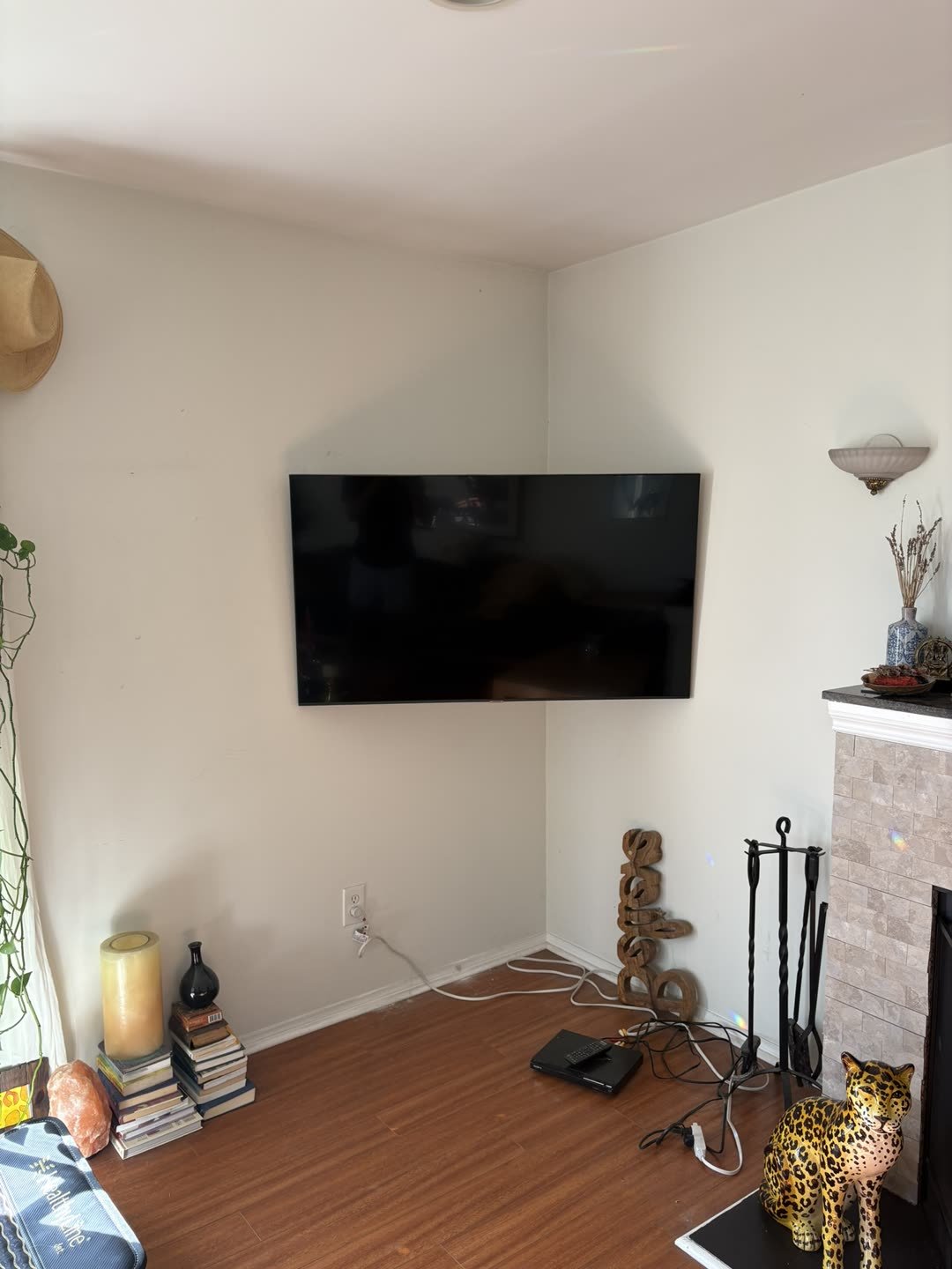 TV mounted in corner of living room