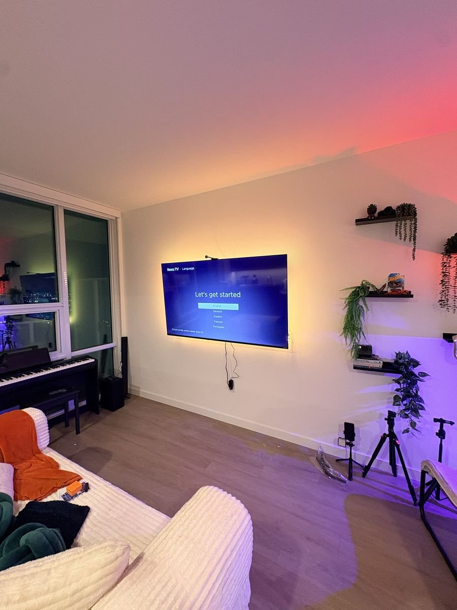 Roku TV on a low-profile wall mount with LED backlighting